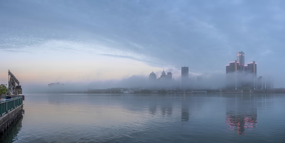 The Detroit skyline (enveloped in fog) as seen from across the Detroit River, in Windsor, Ontario, Canada.