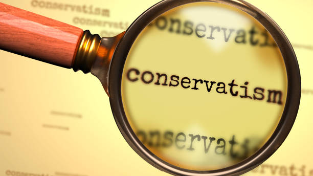 istock Conservatism - word and a magnifying glass enlarging it to symbolize studying, examining or searching for an explanation and answers related to the idea of Conservatism, 3d illustration 1346279286