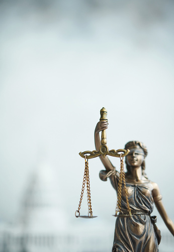 Law and Equality Concept with Scales of Balance and Lady Liberty