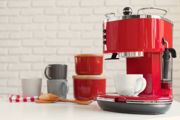 istock Modern kitchen. Red retro style coffee machine close up 1346280839