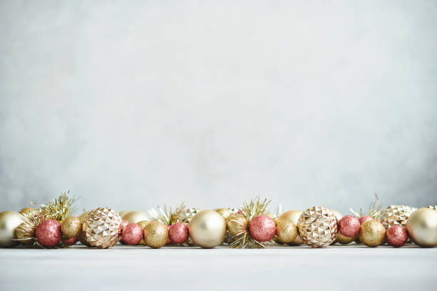 istock Christmas Background with Pink and Gold Ornaments in Bright Setting 1346282041