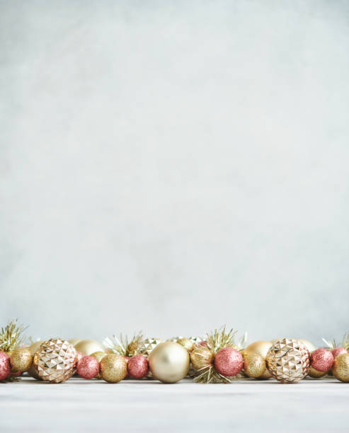 istock Christmas Background with Pink and Gold Ornaments in Bright Setting 1346282567