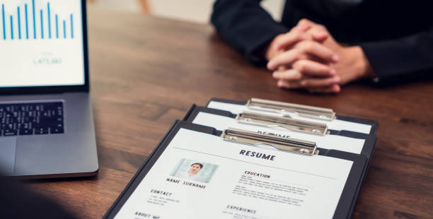 Businesswoman submits resume employer to review job application information on the desk, presents the ability for the company to agree with the position of the job. stock photo