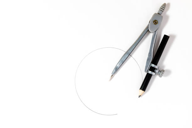 Geometric compasses drawing circle isolated on the yellow background