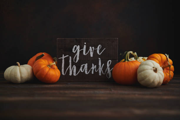 istock Fall Arrangement with Pumpkins and GIVE THANKS sign for Thanksgiving 1346288041
