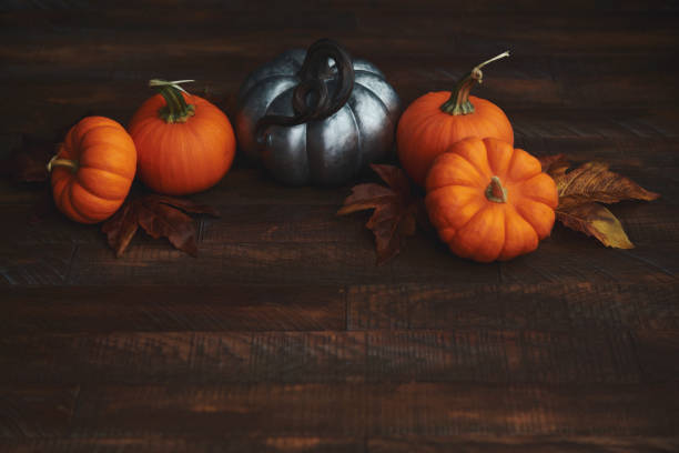 istock Pumpkins and Leaves for Thanksgiving and Fall 1346288130
