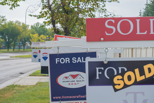 11 September 2020 - Calgary Alberta Canada - Real estate for sale signs.