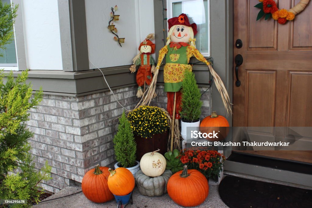 Outdoor decorations for autumn season Fall decorations with pumpkins, mums at front door Autumn Stock Photo