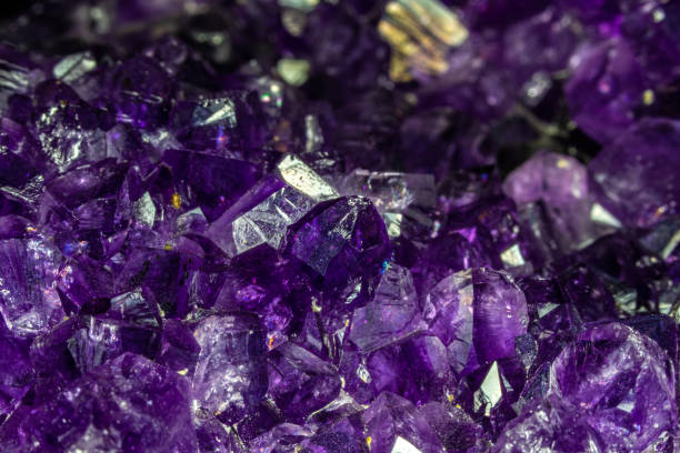 istock Closeup, cluster of amethyst crystals, deep purple. 1346297769