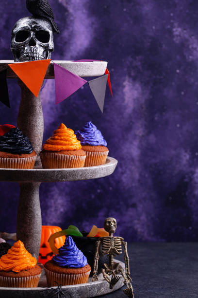 istock Halloween cupcakes with color cream 1346299680