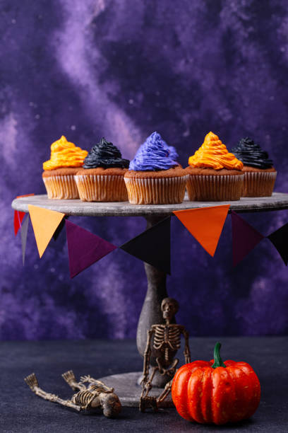 istock Halloween cupcakes with color cream 1346299682
