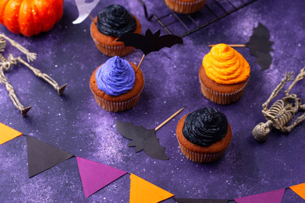 istock Halloween cupcakes with color cream 1346299683