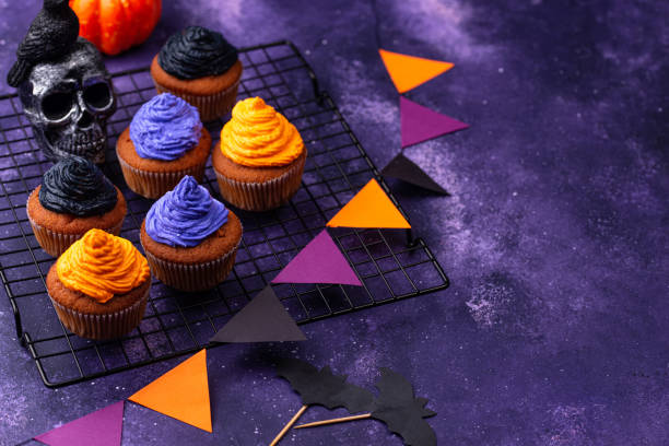 istock Halloween cupcakes with color cream 1346299687