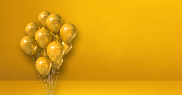 istock Balloons bunch on a yellow wall background. Horizontal banner. 1346299936
