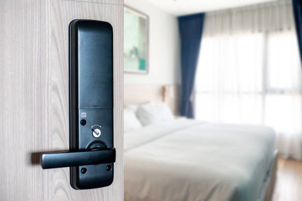 Close up image of digital door lock for hotel door. Electronic door black metal handle for smart life style. Technology about the security system in the village Facilitation and safety for residents. stock photo