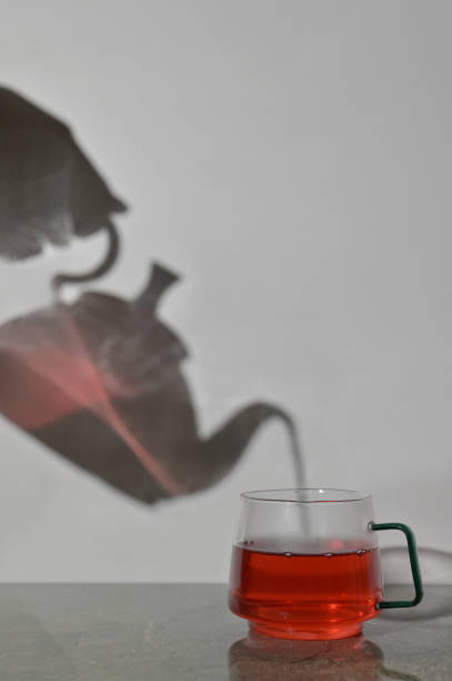 istock Abstract Pot and Cup Of Tea Pouring 1346303079