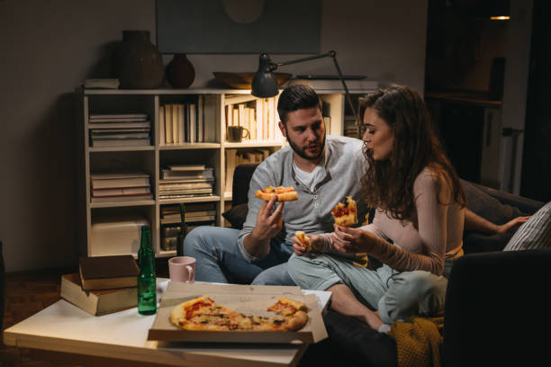 istock friends at home, night scene 1346303227
