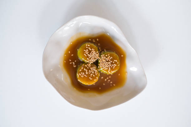 istock Zucchini in sauce with sesame seeds on white plate 1346303964