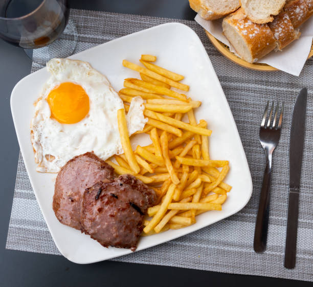 istock Roasted meat cutlet with potato and eggs 1346307495