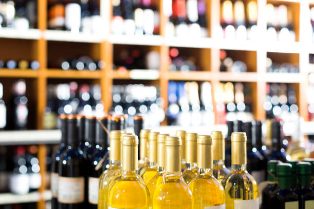 istock View on supermarket shelves with wine bottles 1346308527