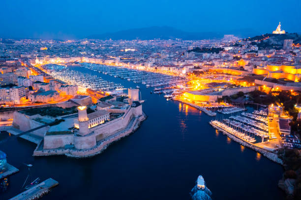 Aerial photo of Marseille, southern France at dusk Aerial photo of Fort Saint-Jean and Old Port of Marseille, southern France. old port photos stock pictures, royalty-free photos & images