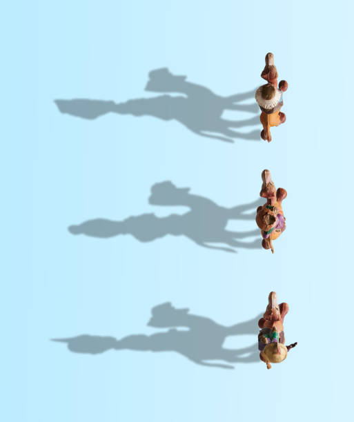 istock Three Wise Men on camel high view, shadows drawing the Three Wise Men on a blue background 1346312048