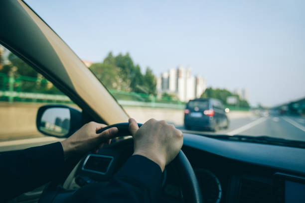 istock Driving car in modern city 1346316864
