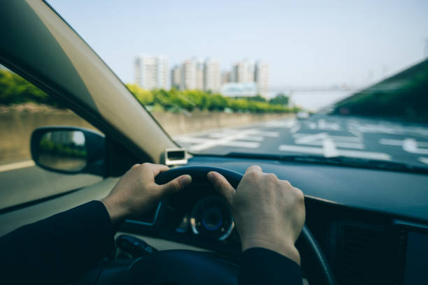 istock Driving car in modern city 1346316868