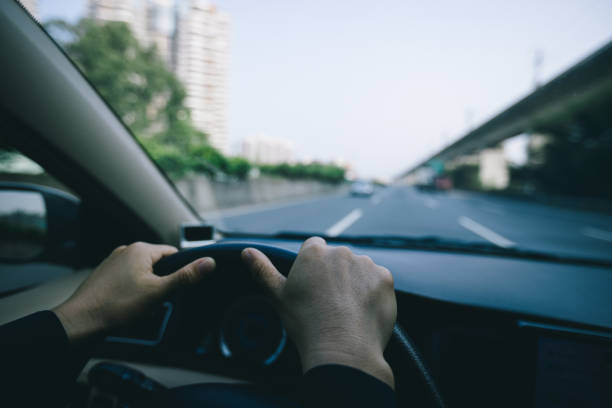 istock Driving car in modern city 1346316892