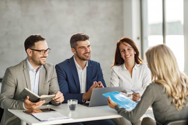 istock Happy human resource team talking to a candidate on a job interview. 1346319030