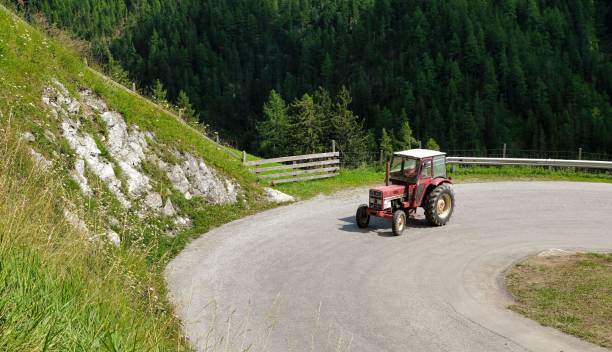 istock a tractor working in the fields high in the mountains 1346320357