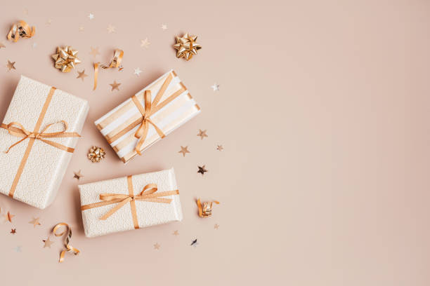 istock Christmas background with gift boxes wrapped in golden colored paper 1346323477