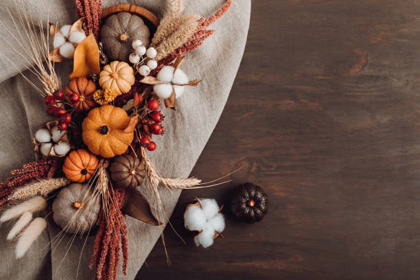 istock Rustic mockup with autumn table decoration. Floral interior decor for fall holidays 1346323535