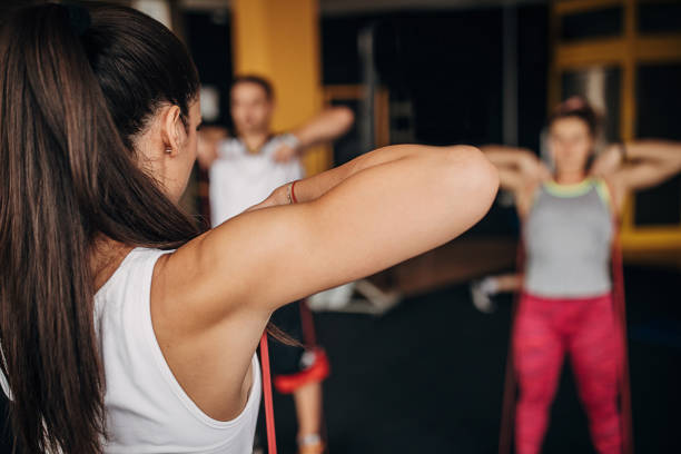 istock People exercising together in gym 1346323614
