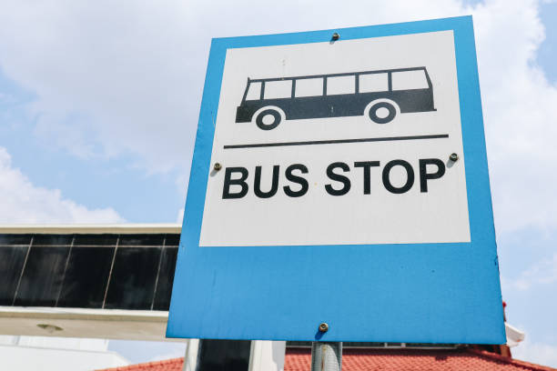 istock Blue and white bus stop sign with sky background 1346323797