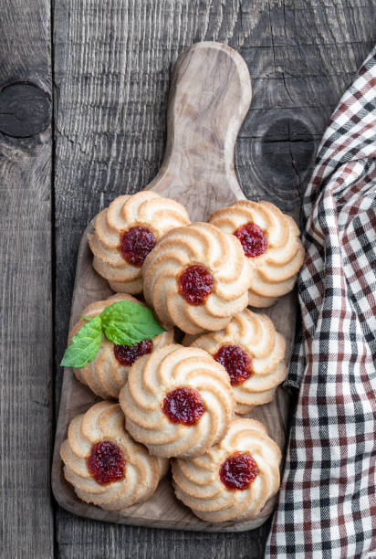 istock Qurabiya cookie shortbread with jam on rustic wooden table 1346323969