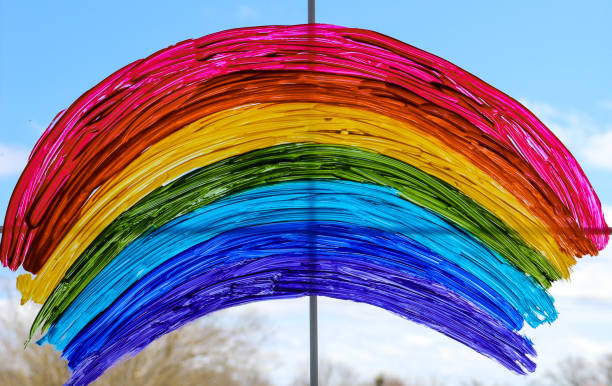 istock Rainbow painted with paints on glass is a symbol for many meanings. 1346324953