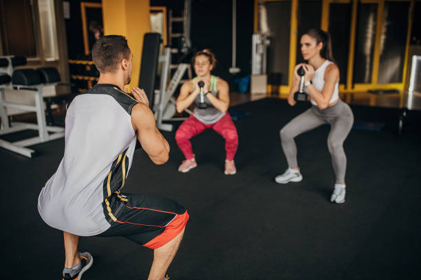 istock People exercising together in gym 1346326515