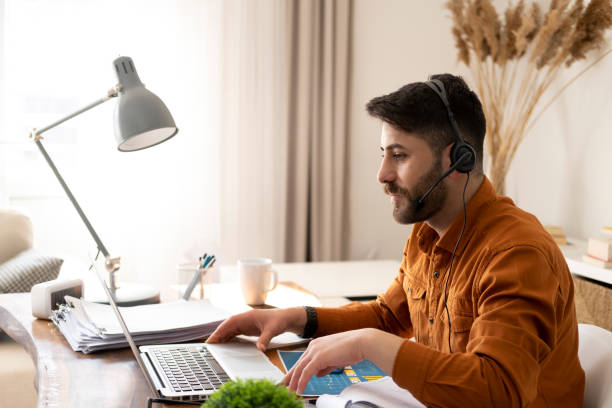 istock Man working on laptop at home 1346330760