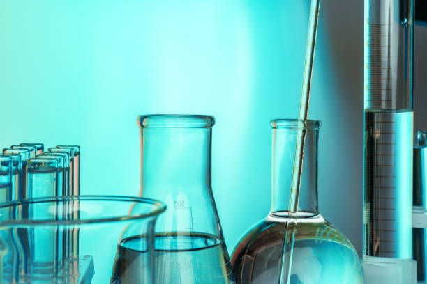 istock Laboratory chemistry glassware on green toned background 1346333536