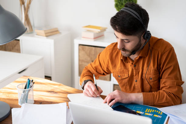 istock Man working on laptop at home 1346336362