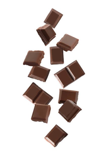 istock Delicious dark chocolate pieces falling on white background 1346339305