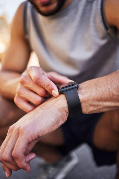 istock Cropped shot of an unrecognizable man crouching down and setting a timer on his watch before running outside 1346339604