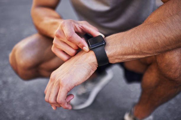 istock Cropped shot of an unrecognizable man crouching down and setting a timer on his watch before running outside 1346339606