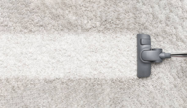 istock Cleaning white carpet with vacuum cleaner 1346340700