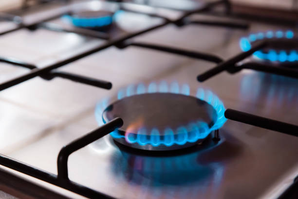 istock Kitchen stove cook with blue flames burning 1346340730