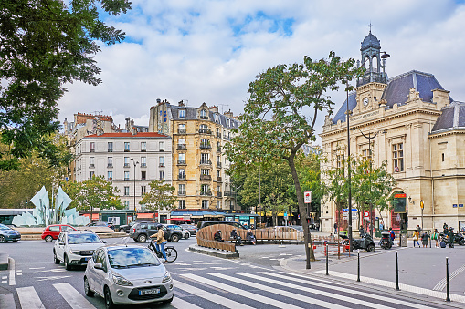 Paris street with typical Haussmannian architecture building on Boulevard Saint Germain