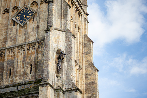 View of one of the new bronze statues of St John the Baptist and Virgin and Child erected on the exterior of St John the Baptist Church, Cirencester in August 2021, replacing those removed back in the 1960's