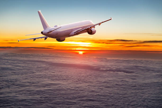 istock Commercial airplane flying above clouds. 1346345124