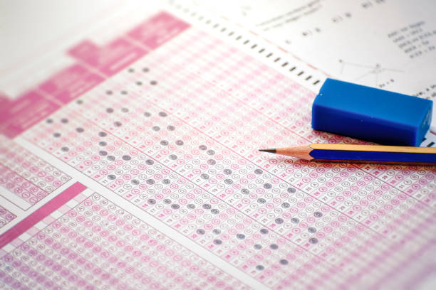 istock exam answer sheet and pencil with eraser on it 1346345494